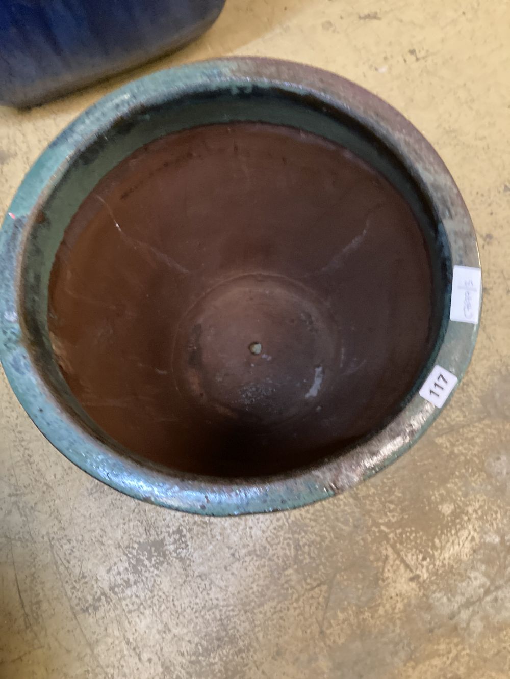 A circular green glazed garden planter, 46cm diameter, height 46cm